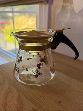 Glass Coffee Carafe with Gold Floral Accents and Black Handle